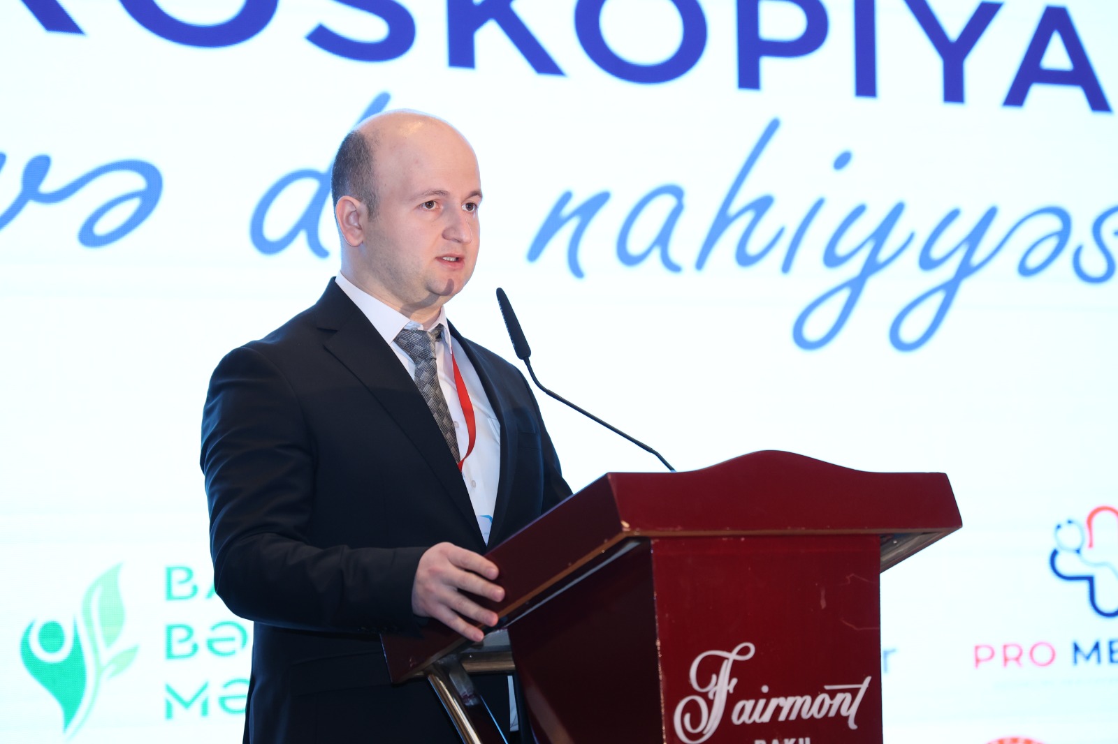 a man standing at a podium