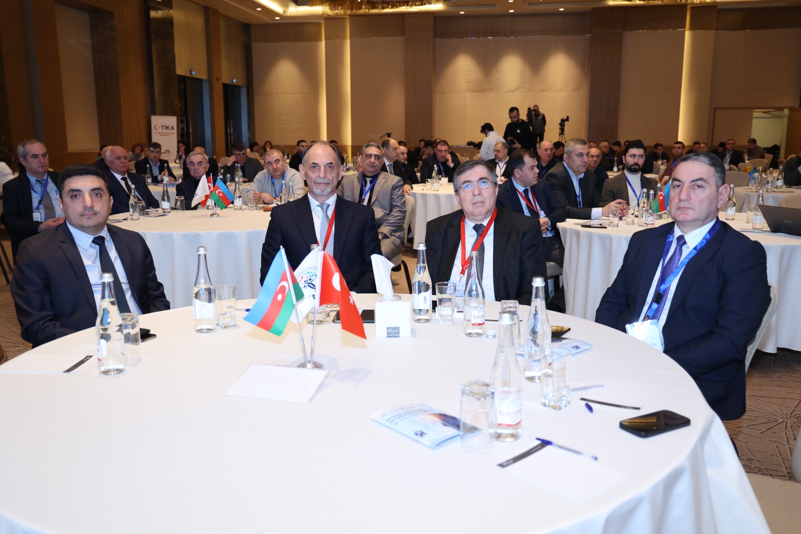 a group of people sitting at tables