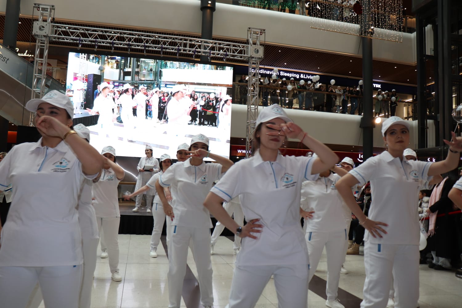 a group of people wearing white uniforms