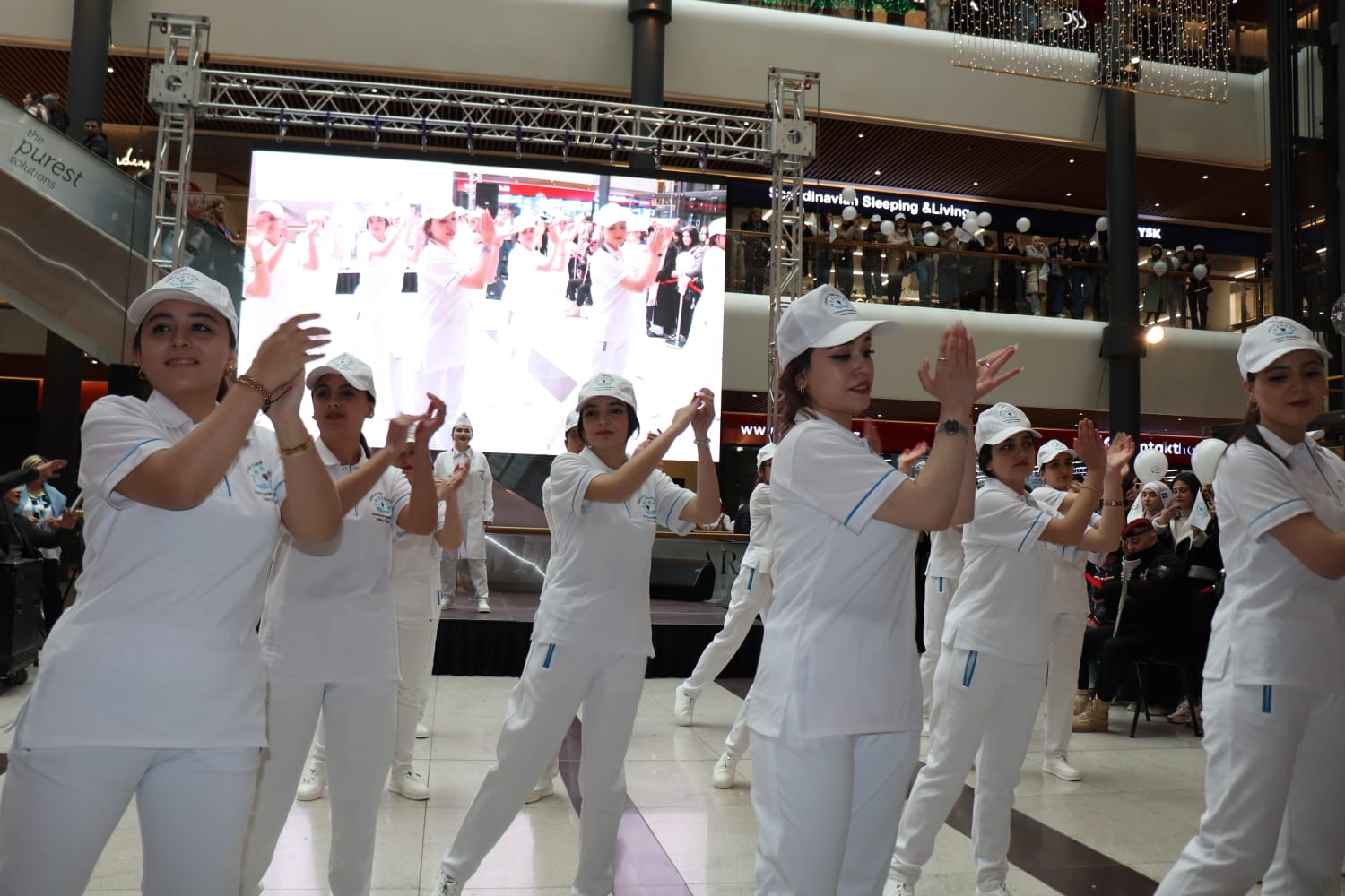 a group of people in white uniforms