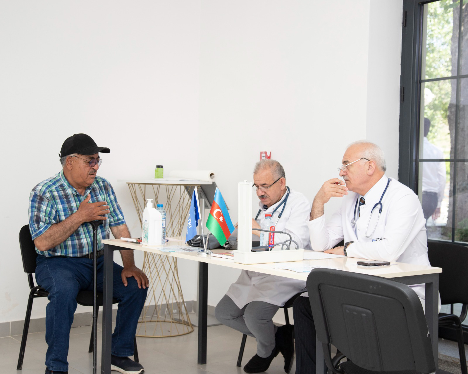 a group of men sitting at a table