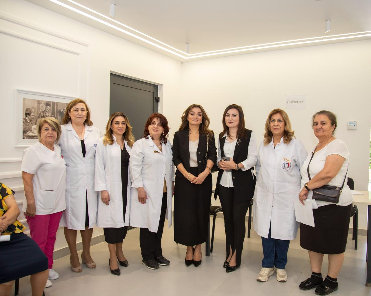 a group of women in white lab coats