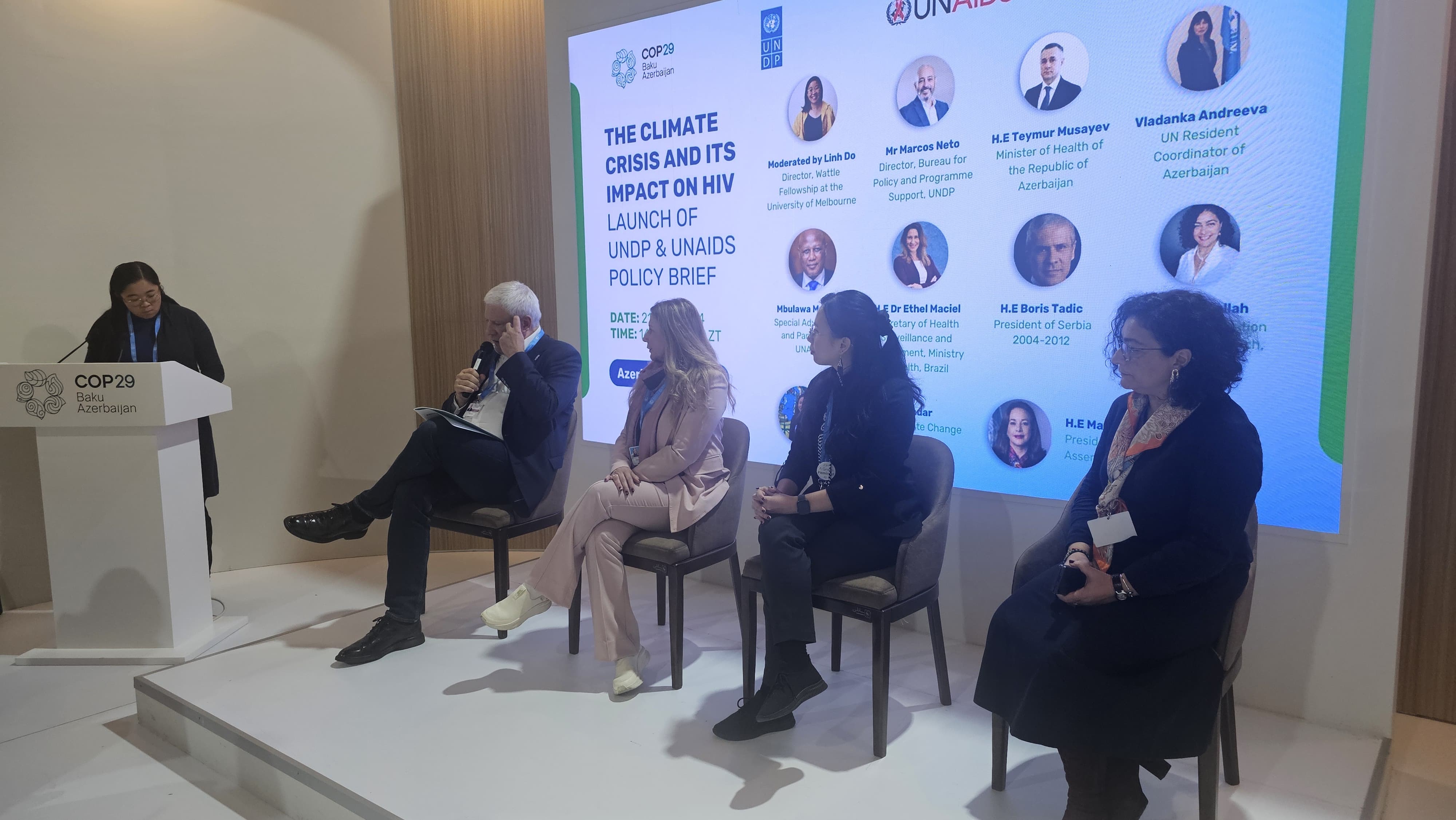 A panel discussion at COP29 in Baku, Azerbaijan, focusing on the climate crisis and its impact on HIV, featuring several speakers.