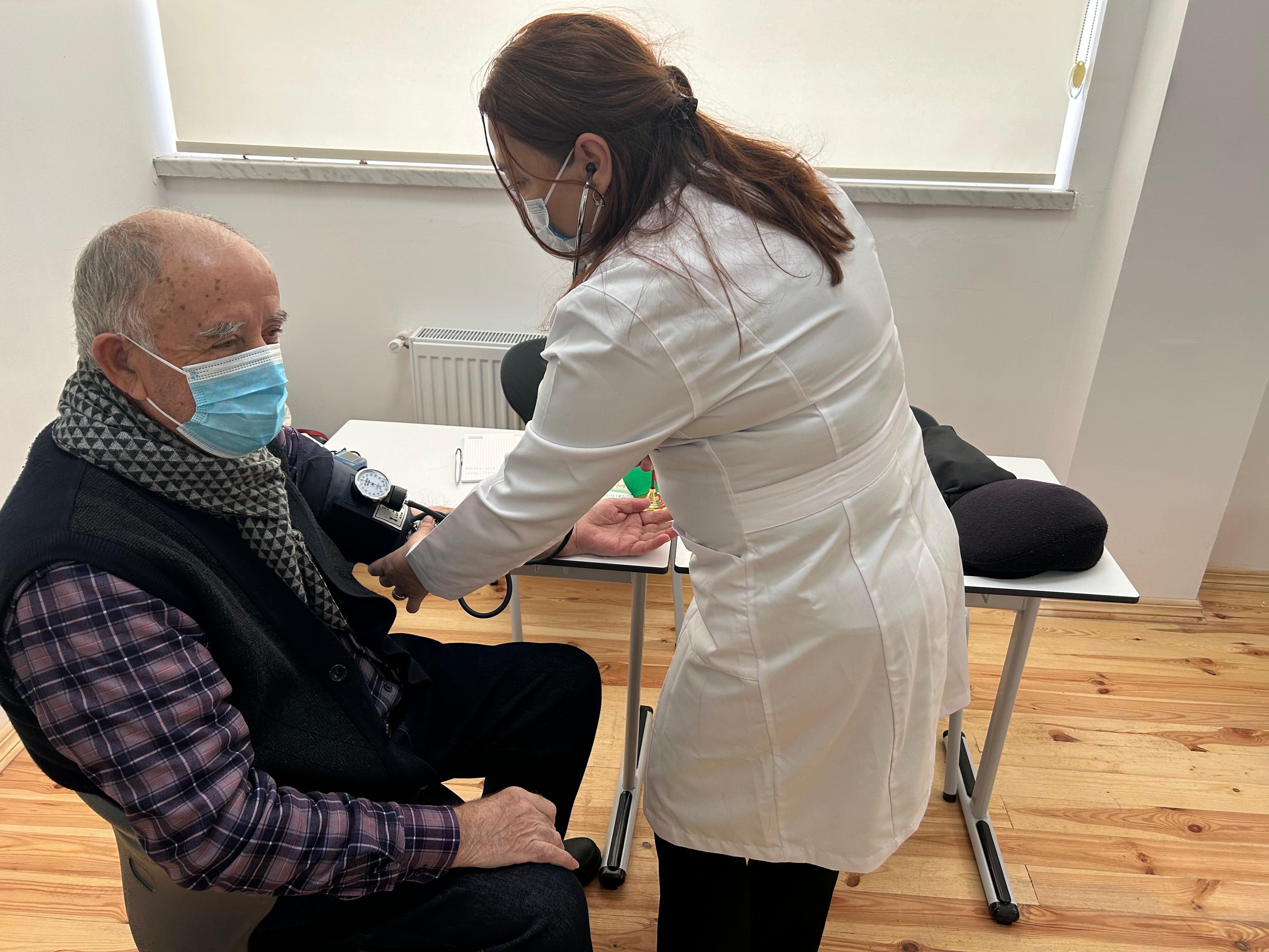 a doctor attending to a patient