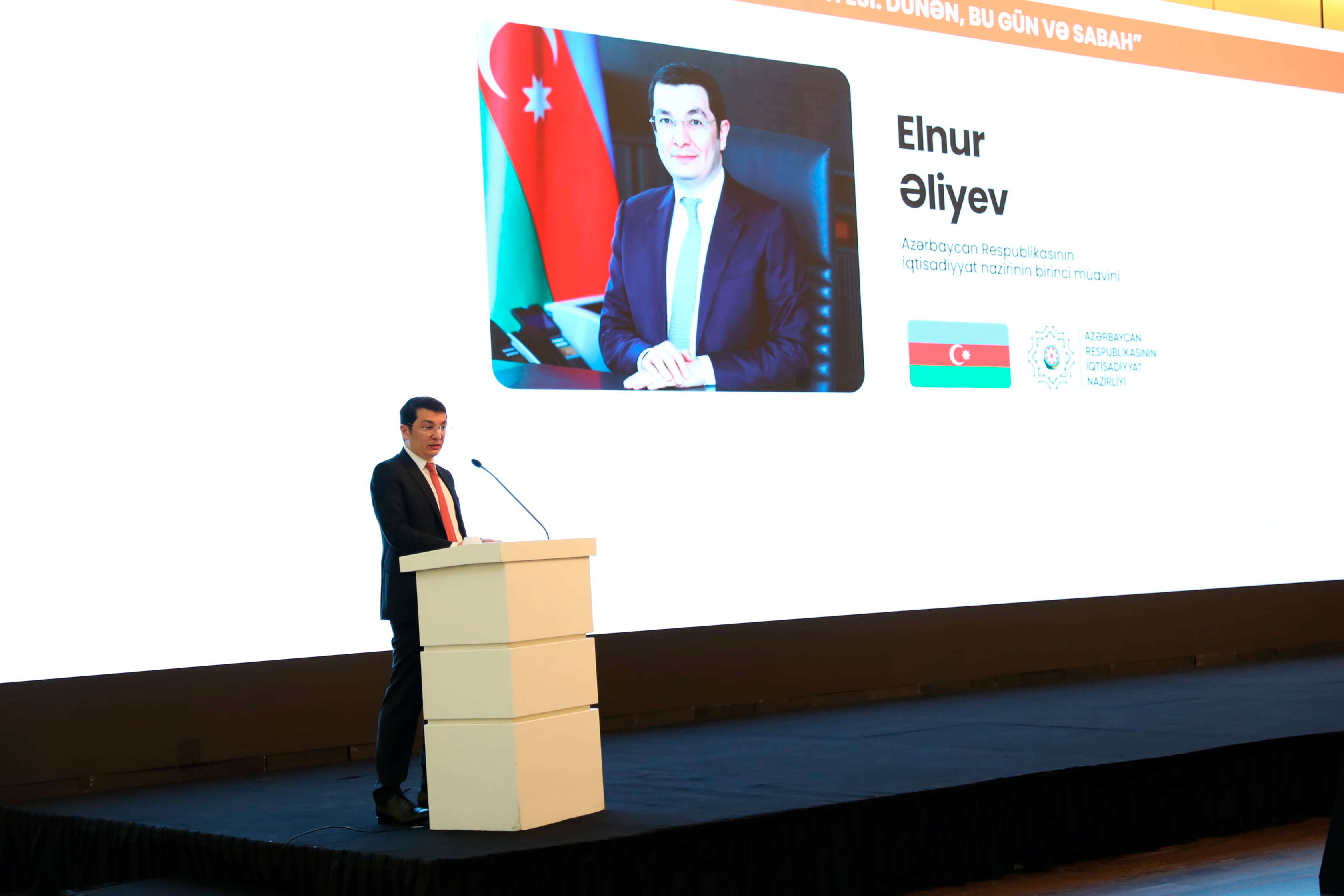 a person standing at a podium