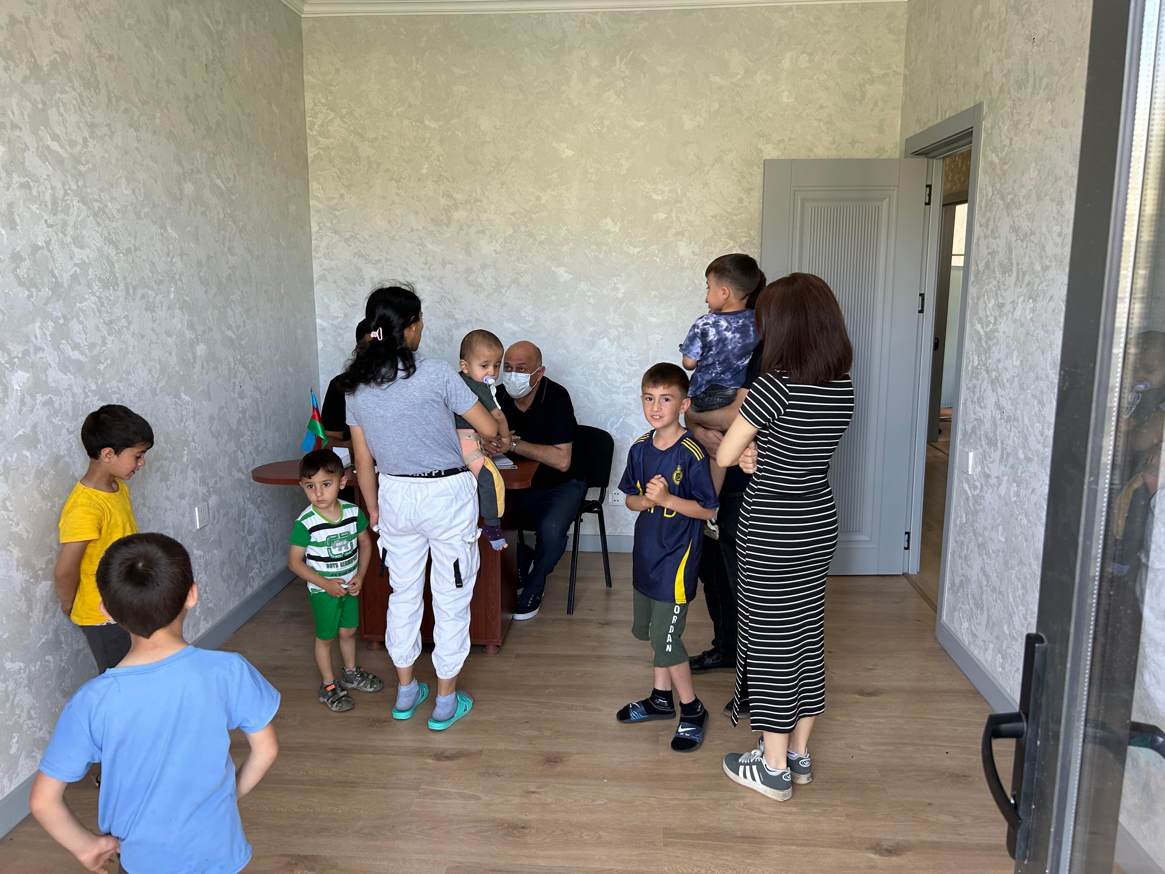 a group of people standing in a room