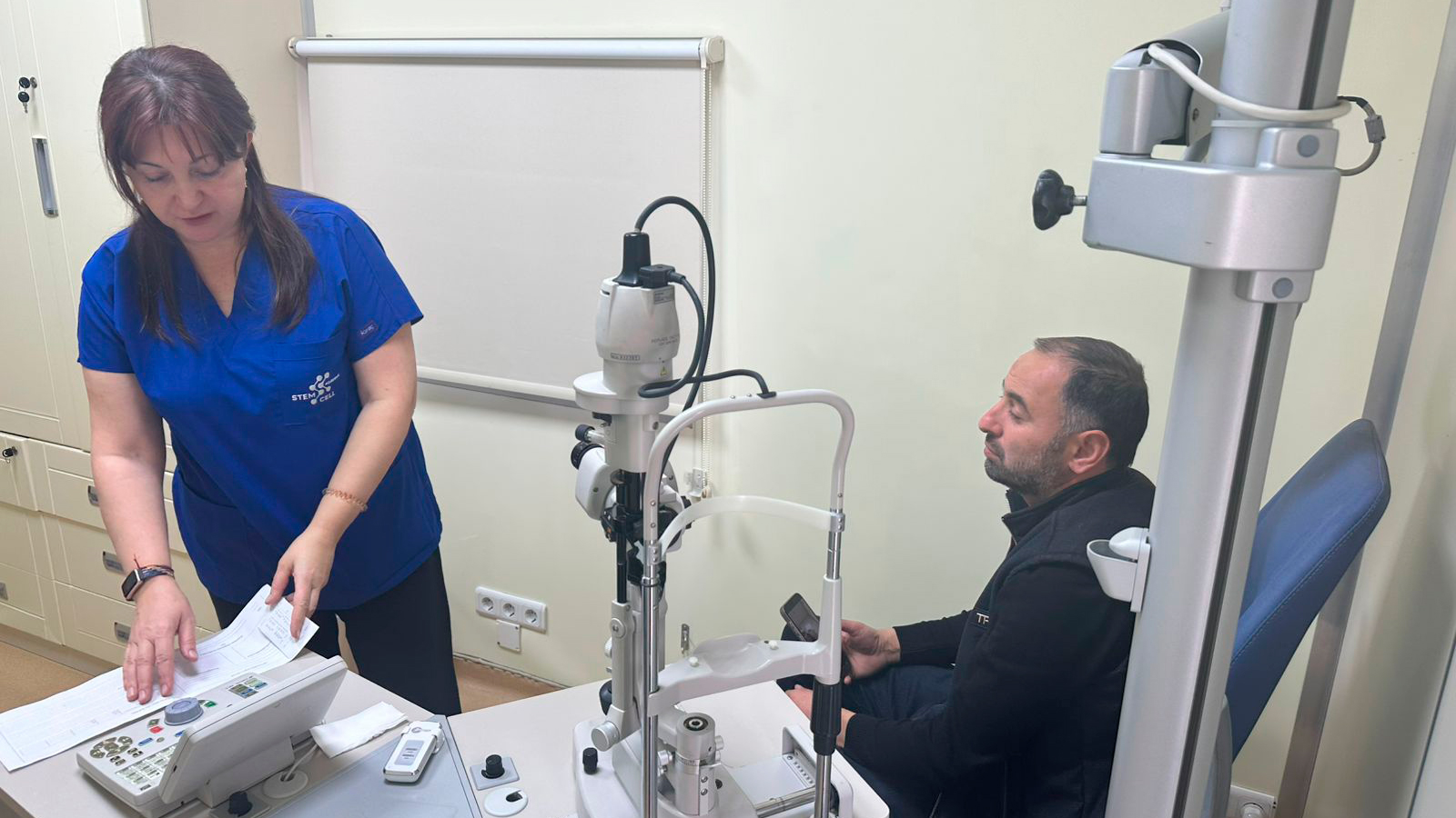 a woman and a man in a hospital room